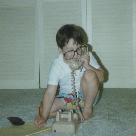 Young Michael Mandel on the phone